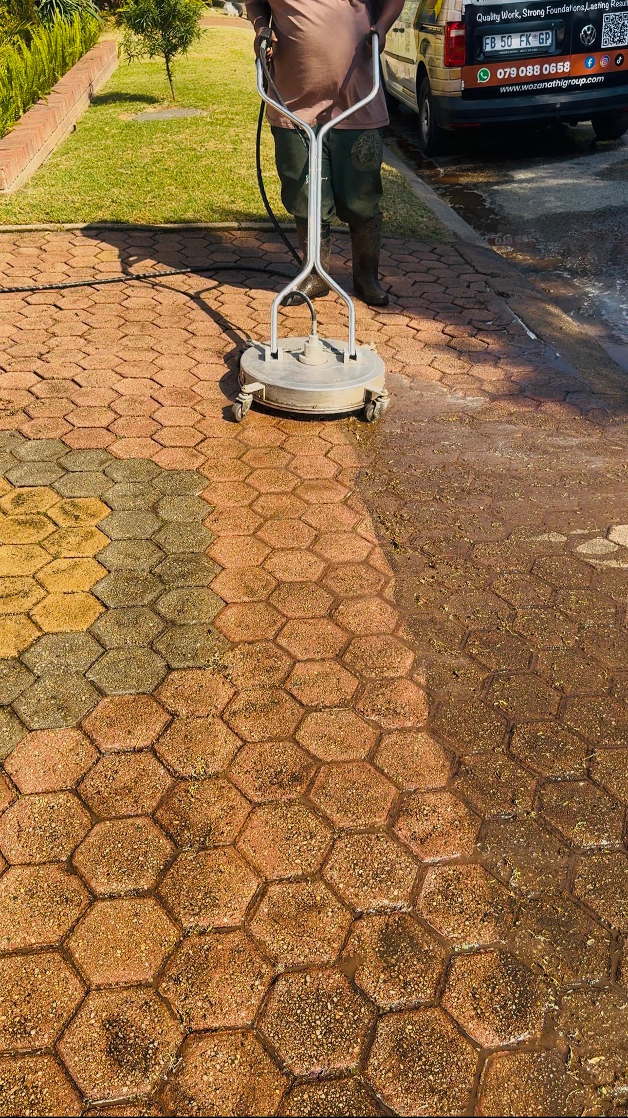 Pressure cleaning of a driveway surface